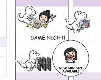 May include: Two sticker designs featuring a cartoon dinosaur and a girl. The first sticker shows the dinosaur and girl playing a board game with the text "Game Night!" The second sticker shows the dinosaur holding a dice and the girl holding a deck of cards. The text "New Mini Size Available" is below the girl. The text "Customize Skin & Hair" is at the top of the image with a row of nine different skin tones and hair colours for the girl.