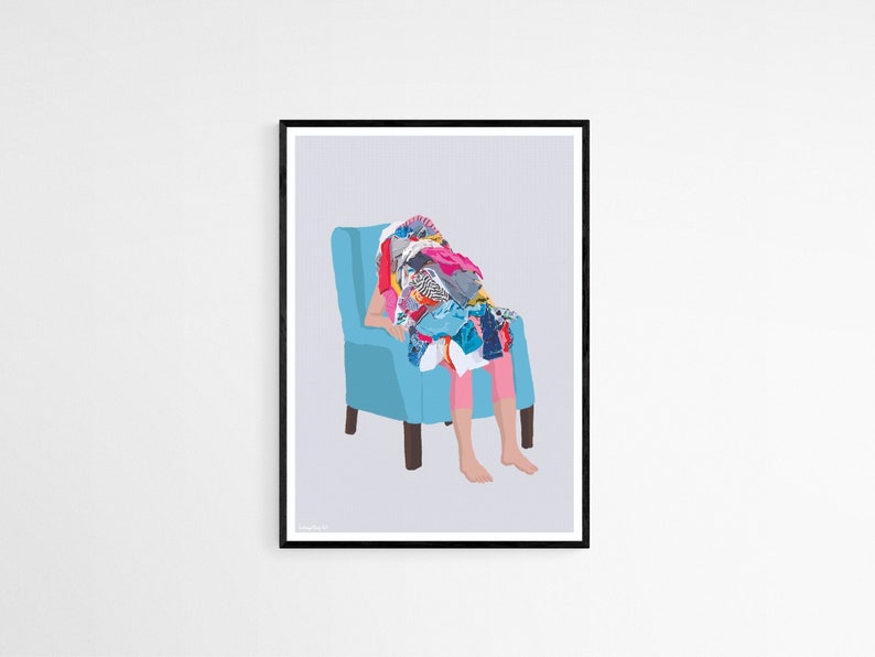 May include: A person sits in a blue armchair, completely covered in a pile of colorful clothing. The person's legs are visible, and they are barefoot.