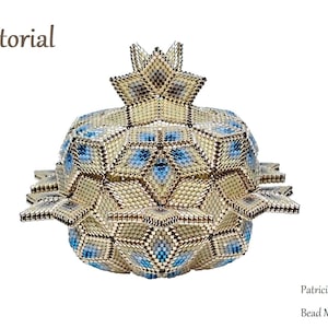 May include: A beaded, geometric, gold and blue, star-shaped box with the text "Tutorial" and "Patricia Verrier Bead Mechanics" on a white background.
