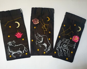 Astrological sign glasses case and its totem flower