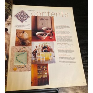 May include: A magazine page with the title "contents" and several images. One image shows a crocheted square, another shows two bowls of soup, and a third features a group of people around a table. Text includes "Thanksgiving in Ojai" and "Granny Squares".