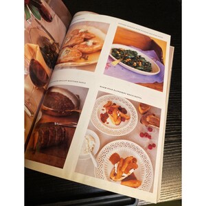 May include: A cookbook page featuring various dishes. Top left shows cooked pears, top right shows sauteed spinach. Bottom left shows a brown sauce, and bottom right shows warm pear raspberry bruschetta on white plates.