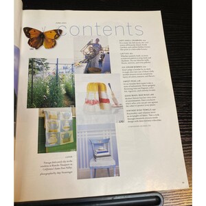 May include: A magazine page with a butterfly, a photo of a person on a boat, and images of food and dish towels. The page includes text and numbers, with a focus on vintage dish towels and food photography.