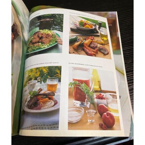 May include: A magazine spread featuring various food dishes. The images showcase grilled vegetables, a plate of meat with a side, and a soup with fruit and herbs. The layout includes text and a variety of food and drink.