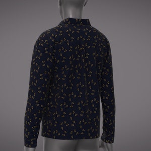 May include: A long-sleeved shirt with a dark blue background and a pattern of small, gold triangles.
