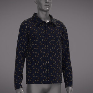 May include: A long-sleeved button-down shirt with a dark blue background and a pattern of small gold triangles.