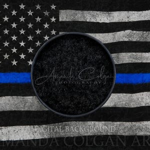 May include: Digital background featuring a distressed American flag with a blue line. The flag has white stars on a black background, with white and black stripes. A circular black area is in the center, with the text "Amanda Colgan Photography" and "Digital Background".