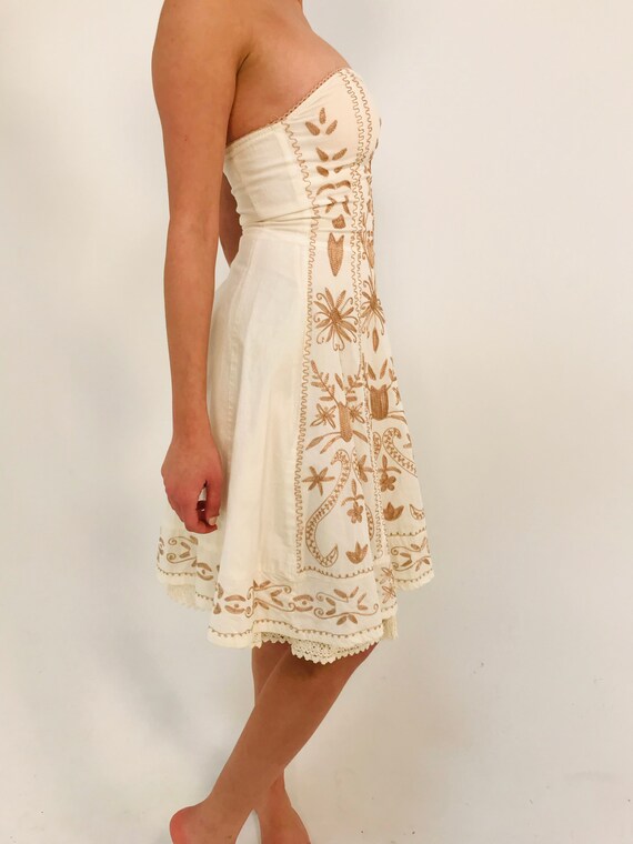 white dress with gold detail