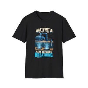 May include: A black short-sleeve t-shirt featuring a graphic of a blue industrial pump system submerged in water with bubbles rising from the bottom. The text reads WASTEWATER OPERATOR at the top and KEEP THE BUGS BREATHING at the bottom.