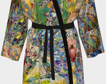 May include: A colorful robe with a black trim and a tie belt. The robe features a vibrant abstract design with birds and flowers.