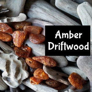 May include: Amber colored stones and pieces of driftwood. The text "Amber Driftwood" is displayed on a black background.