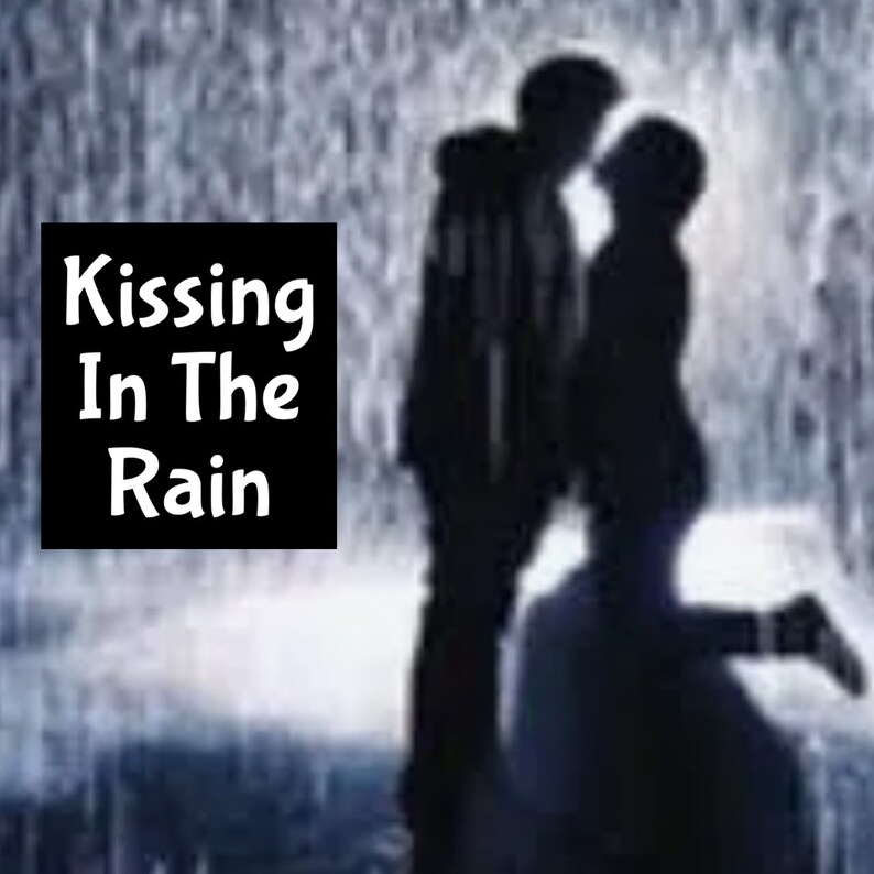 May include: Silhouette of a couple kissing in the rain. The image features a dark background with falling rain and the text "Kissing In The Rain" in a black box.