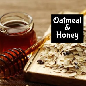 May include: A close-up of a wooden surface with a pile of rolled oats and a jar of honey. A honey dipper is resting on the oats. The text "Oatmeal & Honey" is written in black on a white background.