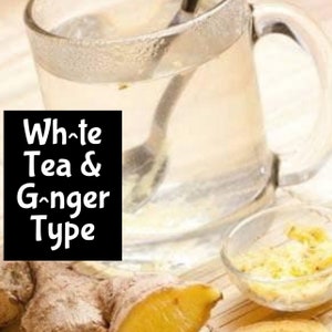 May include: A glass mug filled with white tea and ginger. The mug is on a wooden surface with a small bowl of grated ginger next to it. The text "White Tea & Ginger Type" is written on a black rectangle.