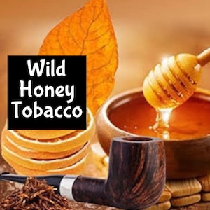 May include: A wooden tobacco pipe with a bowl and a stem, a bowl of honey, a leaf, and a stack of dried orange slices. The text "Wild Honey Tobacco" is on a black square.