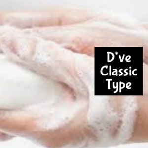 May include: Close-up of hands covered in white foamy soap. A black square with white text reads "D*ve Classic Type". The soap appears to be a creamy, rich formula.