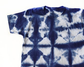 May include: A blue and white tie-dye t-shirt with a geometric pattern.
