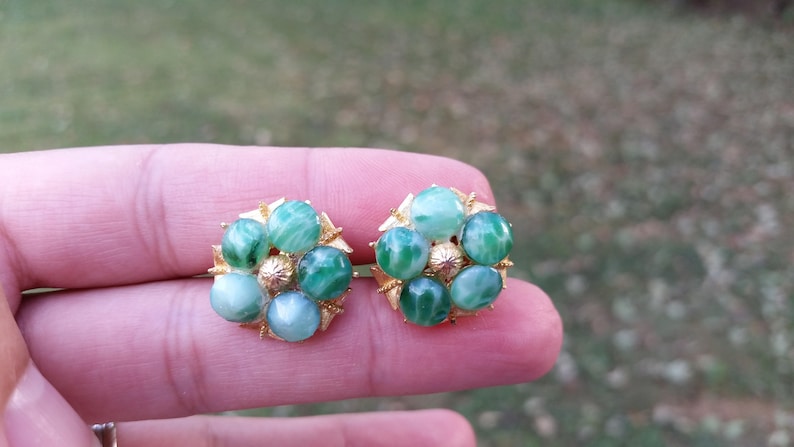 Gold colored with light green clip on earrings