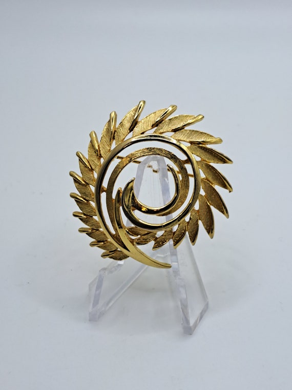 Spiked gold tone spiral brooch
