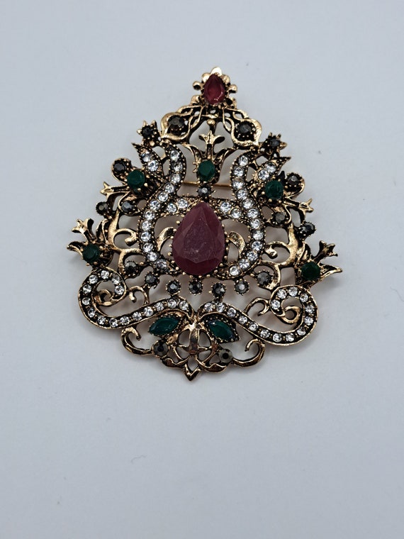 Gold tone jewel colored rhinestone brooch - image 1