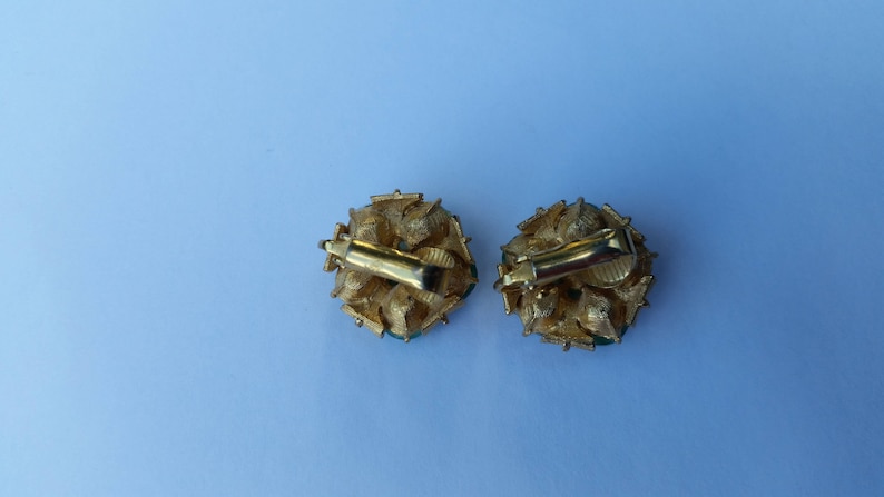 Gold colored with light green clip on earrings
