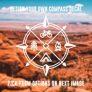 May include: A white compass design with four points, each with a different icon: a mountain, a tent, a campfire, and a bicycle. The compass is set against a blurred background of a desert landscape. The text "DESIGN YOUR OWN COMPASS DECAL" and "PICK FROM OPTIONS ON NEXT IMAGE" is visible at the top and bottom of the image.