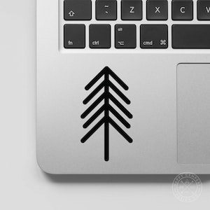 May include: A black and white geometric tree design sticker on a silver laptop.