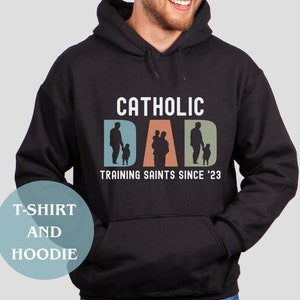 Training Saint Dad Shirt for Catholic T Shirt Father Parenting Hoodie Catholic Dad Est Shirt Catholic Gifts for Men Catholic Saint Trainer