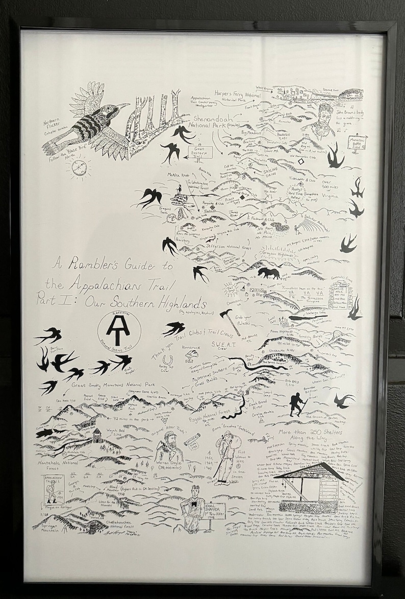 May include: Black and white illustrated map of the Appalachian Trail's Southern Highlands, with hand-drawn elements including birds, mountains, and text. The framed artwork includes the text "A Rambler's Guide to the Appalachian Trail Part I: Our Southern Highlands."