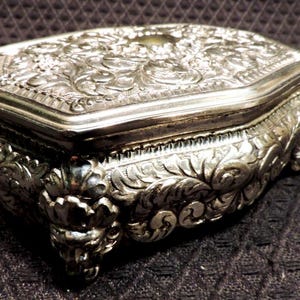 Vintage Silver, Footed Jewelry Box with Leaf Scroll Pattern, Red Cloth Interior with Hinged Lid. (M in Diamond Mark on Base).