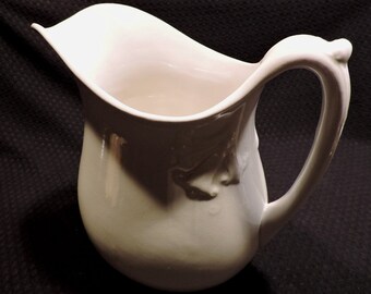 Large Antique Ironstone Pitcher with Embossed Angel Trumpets Near the Handle, Early 1900's