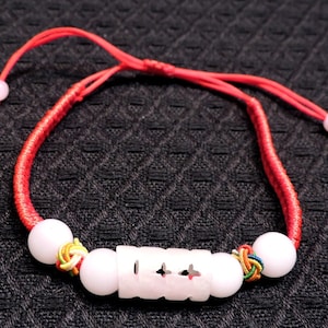 Hand Braided Adjustable Bracelet: With White Jadeite Beads, and Hand Carved Center Longevity Piece