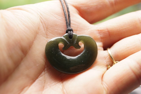 Round greenstone pendant with koru carved into it | The Wildside