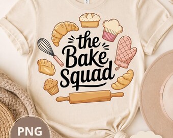May include: A cream-colored t-shirt featuring a graphic print with the text "the Bake Squad" in black script. The design includes illustrations of a whisk, a croissant, a loaf of bread, a cupcake, an oven mitt, a muffin, and a wooden rolling pin.