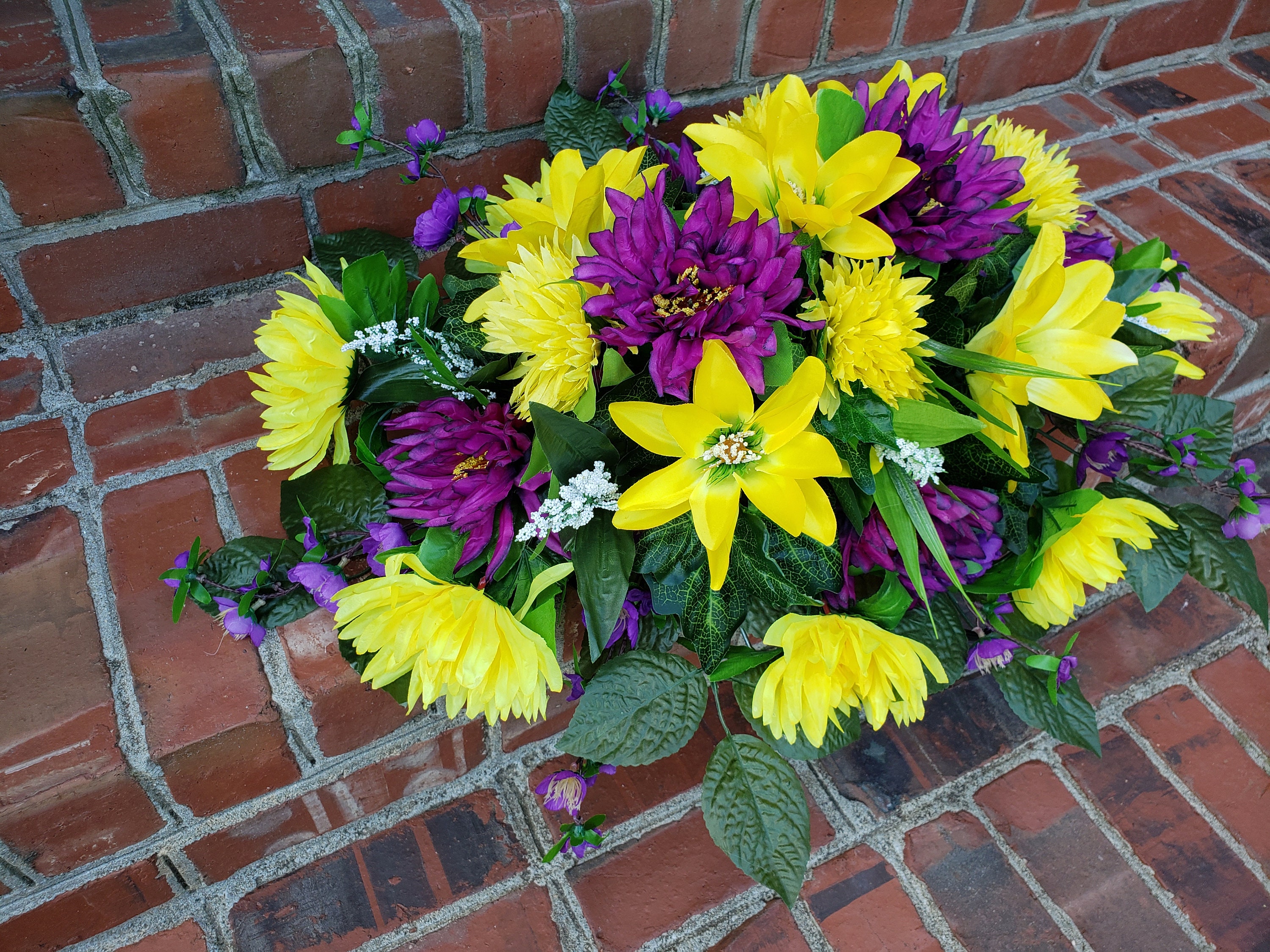 Floral Tributes For Eternal Rest: Saddle Flowers For Headstones