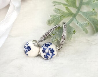 Silver hoop earrings with charm, flower porcelain earrings, white porcelain earrings, tiny drop earrings, blue silver hoop earrings