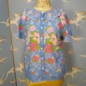 Vintage 1970s floral smocked blouse, size 12 UK, blue angel sleeve blouse