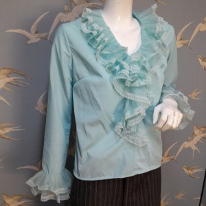 Vintage 1970s pale blue nylon ruffle jabot blouse, ruffle neck sleeve top, size  12- 14 uk/ 40&quot; bust