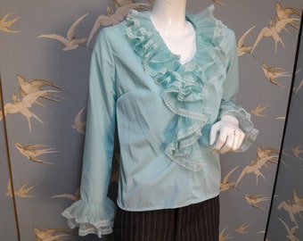 Vintage 1970s pale blue nylon ruffle jabot blouse, ruffle neck sleeve top, size  12- 14 uk/ 40&quot; bust