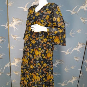 Plus size vintage 1970s dress, black/ orange floral georgette Trevira bell sleeve midi dress, size 16/ 18 UK, 44&quot; bust