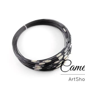 May include: A roll of black stainless steel wire for jewellery making. The wire is coiled and ready to be cut into desired lengths.