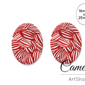 Può includere: Due cammei ovali, ciascuno misura 18 mm per 25 mm, con un design a strisce rosse e bianche. Cameos ArtShop.