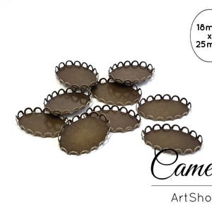 Könnte beinhalten: Ovale, bronzefarbene Cameo-Fassungen mit gewellten Rändern. Die Fassungen sind ca. 18 mm x 25 mm groß. Das Bild enthält den Text "Cameos ArtShop".