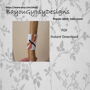 May include: A beaded dragonfly pattern in orange, white, and black colors on a wooden tube. The pattern is a peyote stitch tube cover. The image includes the text "Peyote stitch tube cover" and "PDF Instant Download".