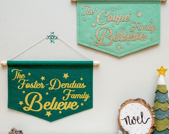 This Family Believes. Family Name Believes Glitter Christmas Banner.