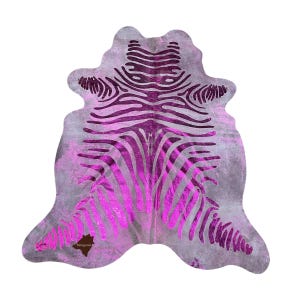 May include: A cowhide rug with a zebra print design in a bright pink color. The rug is made of genuine cowhide and has a natural, distressed look.