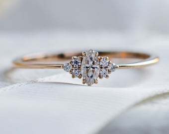 Thin gold ring with moissanites, Marquise shaped moissanite engagement ring