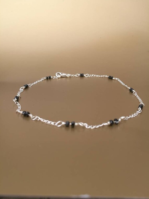 silver and black beads anklets