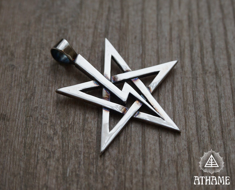 May include: A silver pendant in the shape of a five-pointed star, with a loop at the top for attaching a chain. The star is made of interwoven triangles, creating a complex and intricate design.