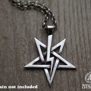May include: A silver five-pointed star pendant with a complex, interwoven design. The pendant is on a silver chain, but the chain is not included. *Chain not included*